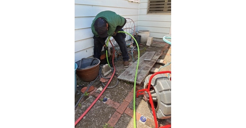 hydro jetting clearing buildup inside residential drain line Sarasota FL