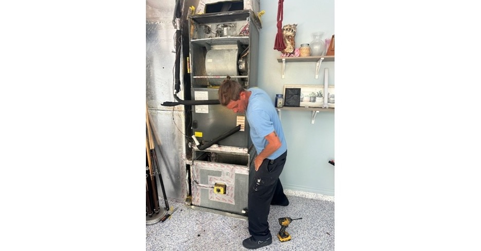 technician performing HVAC system changeout in Sarasota FL preparing home before summer heat