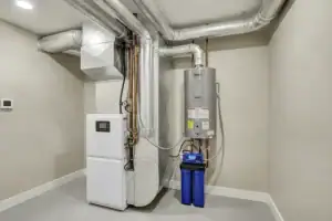 Modern residential hvac system with furnace and water heater setup
